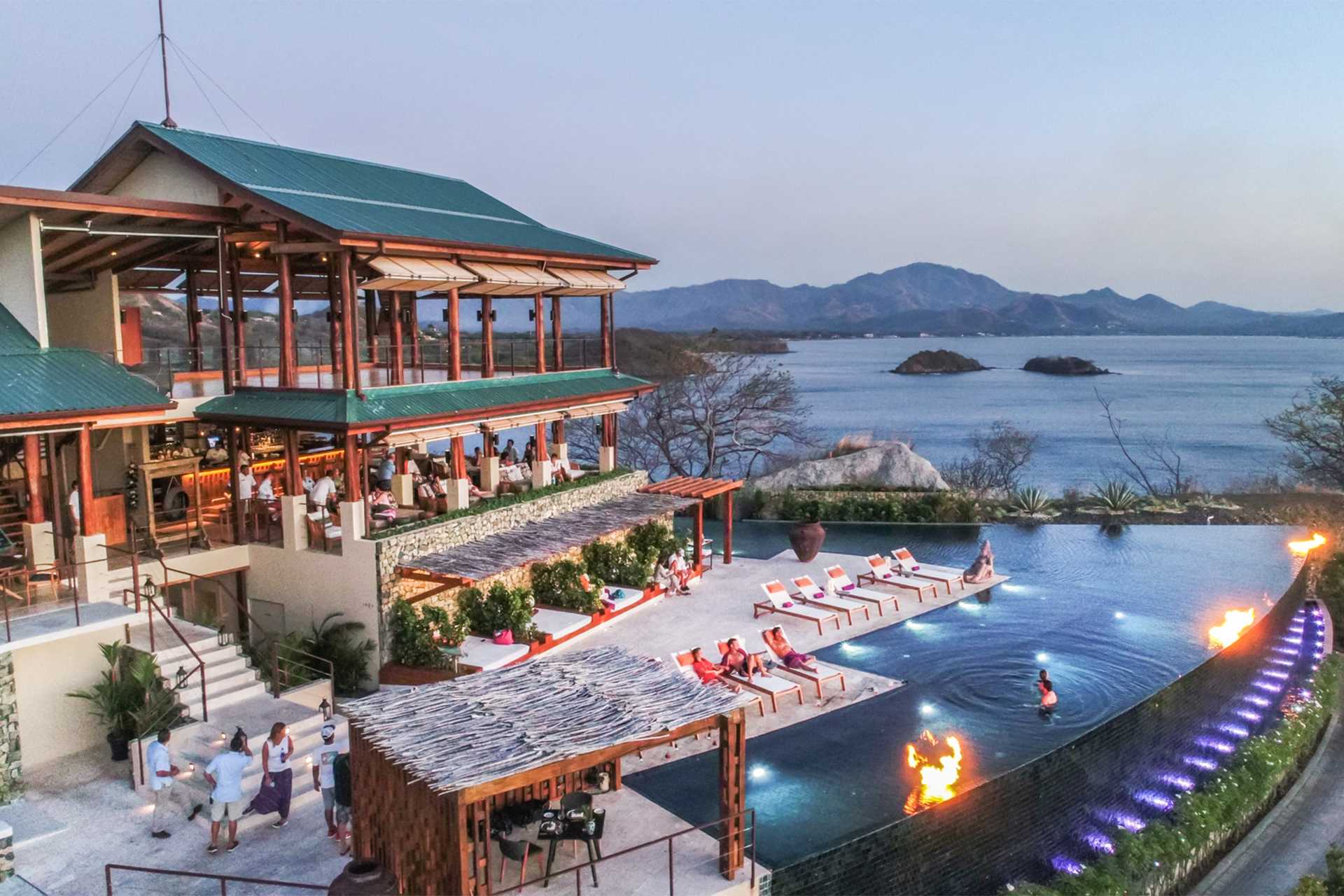 A hotel and pool by the beach